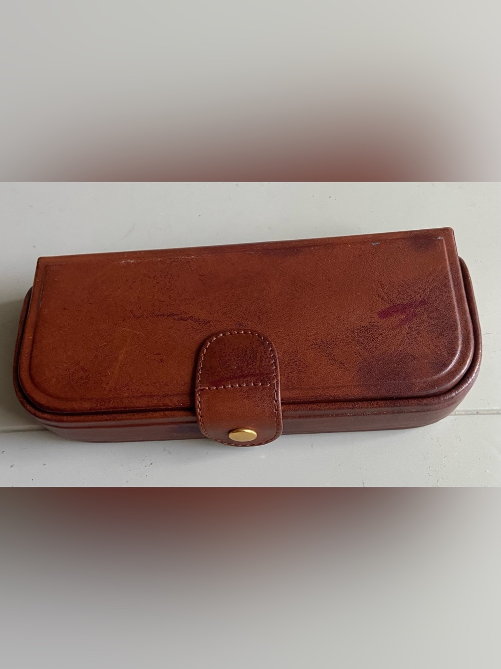 Brown Leather Snap Closure Case with Gold 
Button fo
Size:  6”” x 2 5/8”. 1” hig